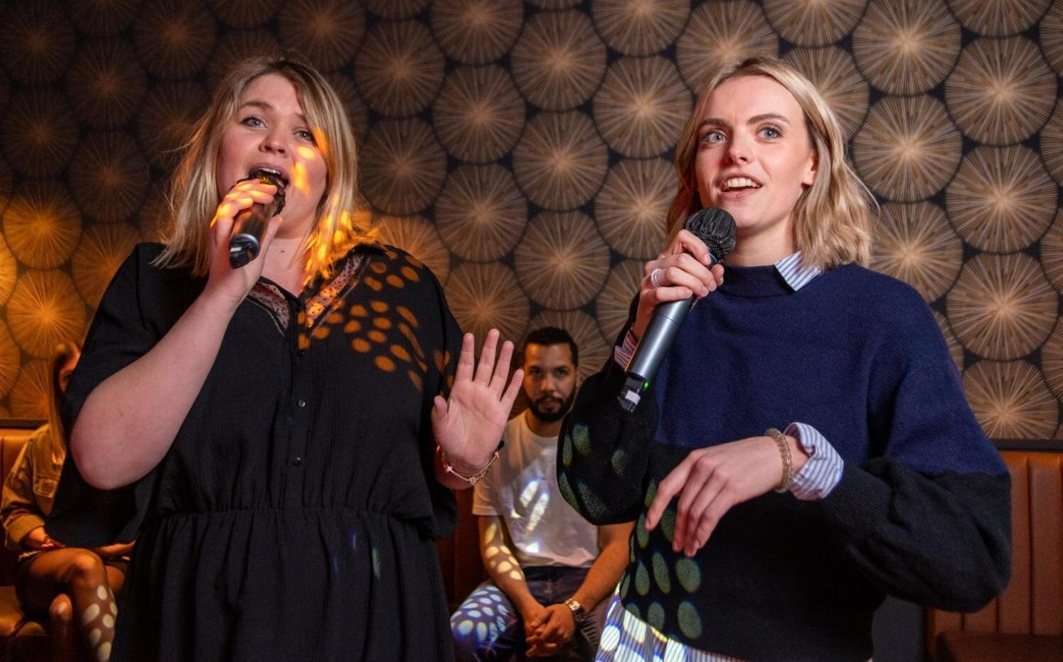 Best friends having fun at karaoke Reims during the bachelorette activity